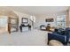 Inviting living room with a comfortable seating arrangement and staircase access at 9435 E 108Th Pl, Commerce City, CO 80640