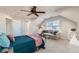 Spacious main bedroom featuring a ceiling fan, seating area and natural light for a bright and open feel at 9435 E 108Th Pl, Commerce City, CO 80640