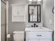 This bathroom showcases a vanity with a marble countertop, a cabinet for storage, and a built-in shower at 8793 Cloverleaf Cir, Parker, CO 80134