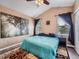 Bright bedroom features vaulted ceiling, a calm color palette, and two windows for natural light at 8793 Cloverleaf Cir, Parker, CO 80134