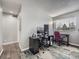 Office featuring a large window, gray walls and wood-look flooring at 8793 Cloverleaf Cir, Parker, CO 80134