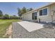 Spacious backyard featuring patio, gravel, yard and the exterior of the home at 16273 E Brown Pl, Aurora, CO 80013