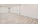 This finished basement features wood-look laminate flooring and lots of open space at 16273 E Brown Pl, Aurora, CO 80013