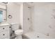 This newly remodeled bathroom features a new vanity and a tiled walk-in shower at 16273 E Brown Pl, Aurora, CO 80013