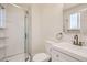 This bathroom features a walk-in shower, vanity and toilet at 16273 E Brown Pl, Aurora, CO 80013