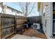 Fenced backyard with grill, space for outdoor seating, and additional home utility installation at 1865 Terry St # 3, Longmont, CO 80501