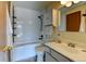 Bathroom featuring white subway tile, a shower-tub combo, and a modern vanity at 1865 Terry St # 3, Longmont, CO 80501