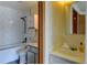 Bathroom featuring white subway tile, a shower-tub combo, and a modern vanity at 1865 Terry St # 3, Longmont, CO 80501