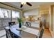 Bright dining area adjoining kitchen with stainless steel appliances and backyard view at 1865 Terry St # 3, Longmont, CO 80501
