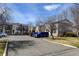 Exterior view of townhome complex featuring well-maintained landscaping and ample parking at 1865 Terry St # 3, Longmont, CO 80501