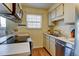 Efficient kitchen with white cabinetry, modern appliances, and practical countertop space at 1865 Terry St # 3, Longmont, CO 80501