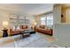 Spacious living room with two sofas, stylish coffee table, and bright natural light at 1865 Terry St # 3, Longmont, CO 80501