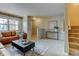 Bright living room with a comfortable couch, accent pillows, and stylish coffee table at 1865 Terry St # 3, Longmont, CO 80501