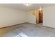 Open living room with staircase and carpeted floors at 1865 Terry St # 3, Longmont, CO 80501