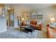 Cozy living room showcasing tasteful artwork, plush sofas, and a decorative rug at 1865 Terry St # 3, Longmont, CO 80501