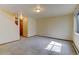 Bright living room features staircase and carpeted floors at 1865 Terry St # 3, Longmont, CO 80501