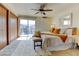 This comfortable main bedroom features a sliding glass door to balcony and carpeted floors at 1865 Terry St # 3, Longmont, CO 80501