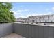Balcony view overlooking the complex and surrounding area with gray siding at 8500 E Jefferson Ave # 16B, Denver, CO 80237
