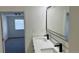 Clean bathroom with dual vanity sinks and modern fixtures, offering ample space and style at 8500 E Jefferson Ave # 16B, Denver, CO 80237