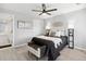 Stylish bedroom with a ceiling fan, modern decor, and gray vinyl floors at 8500 E Jefferson Ave # 16B, Denver, CO 80237