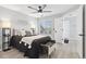 This stylish bedroom features neutral walls, a ceiling fan, and modern decor, creating a relaxing and inviting space at 8500 E Jefferson Ave # 16B, Denver, CO 80237