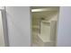 Walk-in closet with built-in shelves and space for hanging clothes at 8500 E Jefferson Ave # 16B, Denver, CO 80237