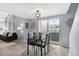 Modern dining area with black table and chairs, rug, and a view to the outside at 8500 E Jefferson Ave # 16B, Denver, CO 80237
