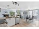 Modern open concept kitchen with stainless steel appliances, granite countertops, and dining area at 8500 E Jefferson Ave # 16B, Denver, CO 80237