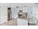 Updated kitchen with stainless steel appliances, granite countertops, and white cabinets at 8500 E Jefferson Ave # 16B, Denver, CO 80237