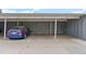Assigned covered parking space for residents' convenience with a blue vehicle at 8500 E Jefferson Ave # 16B, Denver, CO 80237