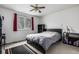 Neutral bedroom featuring carpet, a modern bed, blackout curtains, and a window overlooking the backyard at 2860 Calkins Pl, Broomfield, CO 80020