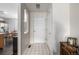 Bright entryway featuring tile floors, a front door, coat closet, and adjacent dining area with natural light at 2860 Calkins Pl, Broomfield, CO 80020