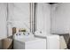 Basement laundry area equipped with a Whirlpool washer and dryer at 2860 Calkins Pl, Broomfield, CO 80020