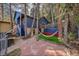 Cozy backyard featuring a hammock and a stone patio, perfect for relaxation at 26378 S End Rd, Kittredge, CO 80457