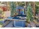 Charming blue two-story home with a red front door and an attached garage at 26378 S End Rd, Kittredge, CO 80457