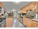 Bright kitchen featuring granite countertops, tile floors and stainless appliances at 26378 S End Rd, Kittredge, CO 80457
