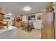 Bright kitchen with wooden cabinets and a dining area, great for Gathering meals at 26378 S End Rd, Kittredge, CO 80457