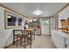 Kitchen featuring a dining area, tile floors and door to the exterior at 26378 S End Rd, Kittredge, CO 80457