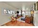 Comfortable living room with a wood-burning stove and hardwood floors at 26378 S End Rd, Kittredge, CO 80457