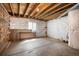 Unfinished basement featuring exposed ceiling, concrete floors, and a small window at 4421 Tanager Trl, Broomfield, CO 80023