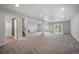 Large finished basement with recessed lights, carpeted floors, and a walkout to the backyard at 4421 Tanager Trl, Broomfield, CO 80023
