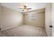 Spacious bedroom featuring neutral walls, carpeted floors, and a ceiling fan with light at 4421 Tanager Trl, Broomfield, CO 80023