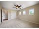 Bright bedroom with natural light showcases three windows and a closet with sliding doors at 4421 Tanager Trl, Broomfield, CO 80023