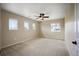 Comfortable bedroom with a ceiling fan and three windows offering natural light at 4421 Tanager Trl, Broomfield, CO 80023