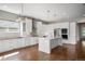Modern kitchen with a large island, stainless steel appliances, white cabinets, and stylish backsplash at 4421 Tanager Trl, Broomfield, CO 80023