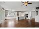 Spacious and bright kitchen featuring a large island, stainless steel appliances, and white cabinets at 4421 Tanager Trl, Broomfield, CO 80023