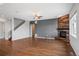 Bright, open living room with hardwood floors and a wood-accented fireplace, perfect for entertaining at 4421 Tanager Trl, Broomfield, CO 80023