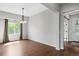 Bright dining room showcasing hardwood floors, neutral walls, decorative chandelier and natural light from the outside at 4421 Tanager Trl, Broomfield, CO 80023