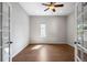 Bright room showcasing hardwood floors, neutral walls, a ceiling fan, and window allowing natural light to illuminate the space at 4421 Tanager Trl, Broomfield, CO 80023