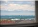 Picturesque view of mountains and distant cityscape from a home's upper floor at 4421 Tanager Trl, Broomfield, CO 80023